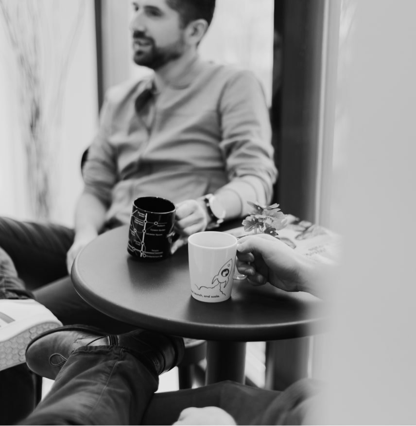 Kodius team chatting at the office
